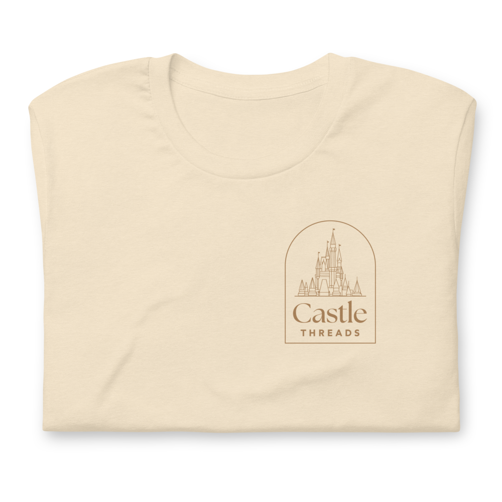 Folded beige t-shirt with 'Castle Threads' logo